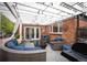 Outdoor patio features a cozy seating area under a pergola with string lights, perfect for entertaining at 4011 S Ivy Ln, Cherry Hills Village, CO 80111