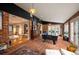 Recreation room featuring a billiard table, brick walls, and an open floorplan to the other spaces at 4011 S Ivy Ln, Cherry Hills Village, CO 80111