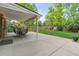 Spacious covered back patio featuring outdoor seating and string lights, perfect for entertaining or relaxing outdoors at 6222 S Ames Ct, Littleton, CO 80123