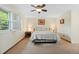 Cozy bedroom featuring neutral carpet, and windows with shutter-style blinds at 6222 S Ames Ct, Littleton, CO 80123