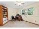 Bedroom featuring neutral carpet, and windows with shutter-style blinds at 6222 S Ames Ct, Littleton, CO 80123