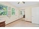 Bedroom featuring neutral carpet, and mirrored closet doors at 6222 S Ames Ct, Littleton, CO 80123