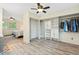 Spacious main bedroom featuring an open closet space, hardwood floors, and natural light at 6222 S Ames Ct, Littleton, CO 80123