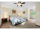 Serene main bedroom with plush carpeting, soft lighting, and a cozy atmosphere at 6222 S Ames Ct, Littleton, CO 80123