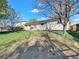 Spacious backyard with mature trees, a well-maintained lawn, offering a serene outdoor escape for relaxation and activities at 10878 Grange Creek Dr, Thornton, CO 80233