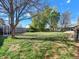 Large, fenced backyard with a mix of sun and shade, perfect for gardening, play, and enjoying outdoor activities at 10878 Grange Creek Dr, Thornton, CO 80233