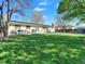Spacious backyard with lush green grass, a patio set, and a privacy fence, perfect for outdoor enjoyment at 10878 Grange Creek Dr, Thornton, CO 80233