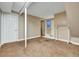 Unfinished basement featuring an open space, closet, and neutral-colored walls and carpet flooring at 10878 Grange Creek Dr, Thornton, CO 80233