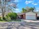 Charming one-story home with brick and siding, featuring a well-maintained front yard and attached two-car garage at 10878 Grange Creek Dr, Thornton, CO 80233