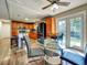 Open-concept kitchen with a large island, stainless steel appliances, and a seamless flow to the dining and living areas at 10878 Grange Creek Dr, Thornton, CO 80233