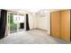 Basement with sliding glass doors, neutral carpet, and natural light at 9946 W Cornell Pl, Lakewood, CO 80227