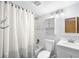 Bathroom with shower-tub combination, cabinet, and modern sink at 9946 W Cornell Pl, Lakewood, CO 80227