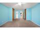 Bedroom featuring neutral carpeting, ceiling fan and closets at 9946 W Cornell Pl, Lakewood, CO 80227