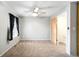 Bedroom with ample natural light, neutral carpet, and spacious closet at 9946 W Cornell Pl, Lakewood, CO 80227