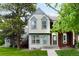 Charming two-story townhome with light-colored siding, gray trim and a well-maintained lawn at 9946 W Cornell Pl, Lakewood, CO 80227