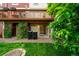 Ground level patio with sliding door and green space at 9946 W Cornell Pl, Lakewood, CO 80227