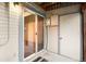 Small patio with sliding glass door and apartment number at 9946 W Cornell Pl, Lakewood, CO 80227