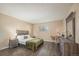 Cozy bedroom with a queen-sized bed, dresser, and a bright window at 430 Zang St # 4-102, Lakewood, CO 80228