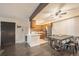 Open dining area features modern table and chairs adjacent to a compact kitchen at 430 Zang St # 4-102, Lakewood, CO 80228