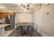 Bright dining area with modern table and chairs next to the kitchen and closet at 430 Zang St # 4-102, Lakewood, CO 80228