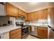 Well-equipped kitchen featuring stainless steel appliances and ample cabinet space at 430 Zang St # 4-102, Lakewood, CO 80228