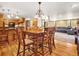 Open floor plan with dining room and living room with hardwood flooring at 8791 Grizzly Way, Evergreen, CO 80439