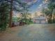 A house with a two car garage and plenty of driveway space at 8791 Grizzly Way, Evergreen, CO 80439