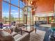 Living room with large window and views, comfortable seating, and an adjacent sitting area at 8791 Grizzly Way, Evergreen, CO 80439