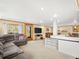 Basement living room with an open floor plan and outside access at 8791 Grizzly Way, Evergreen, CO 80439