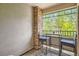 Relaxing balcony space with outdoor furniture and a view of lush greenery at 9300 E Florida Ave # 906, Denver, CO 80247