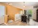 Dining area featuring a stylish table with balcony access and an adjacent staircase, seamlessly blending living spaces at 9300 E Florida Ave # 906, Denver, CO 80247