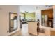 Open kitchen featuring stainless steel appliances, a breakfast bar, and a living room view at 9300 E Florida Ave # 906, Denver, CO 80247