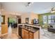 Inviting living room flows to a dining area, featuring modern finishes and abundant natural light, creating an open and airy ambiance at 9300 E Florida Ave # 906, Denver, CO 80247