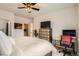 Bedroom featuring a cozy bed, and modern decor, complete with a stylish ceiling fan and ample natural light at 9300 E Florida Ave # 906, Denver, CO 80247