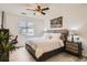 Cozy bedroom retreat featuring a comfortable bed, ceiling fan, and natural light, complete with modern decor at 9300 E Florida Ave # 906, Denver, CO 80247