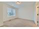 Bright bedroom with plush carpeting and a large window offering natural light at 1755 Peak Loop, Broomfield, CO 80023
