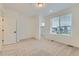 Spacious bedroom with carpet, closet, and natural light from the large window at 1755 Peak Loop, Broomfield, CO 80023