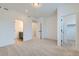 Open bedroom featuring an ensuite bathroom and a large walk-in closet at 1755 Peak Loop, Broomfield, CO 80023