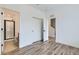 Spacious bedroom with wood floors, closet, and access to ensuite bathroom and hallway at 1755 Peak Loop, Broomfield, CO 80023