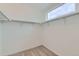 Walk-in closet with ample hanging space and a window for natural light at 1755 Peak Loop, Broomfield, CO 80023