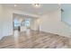 Open-concept living area featuring modern flooring and seamless flow into the kitchen at 1755 Peak Loop, Broomfield, CO 80023