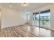 Open living space with a large sliding glass door that opens onto an outdoor deck at 1755 Peak Loop, Broomfield, CO 80023