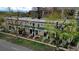 Aerial view of townhomes featuring green roofing, landscaping, and street view at 553 N Logan St, Denver, CO 80203