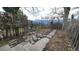 Backyard with a stone walkway, a wooden fence, and an archway; needs some landscaping at 553 N Logan St, Denver, CO 80203