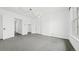 Spacious bedroom with neutral walls, gray carpeting and ample natural light at 553 N Logan St, Denver, CO 80203