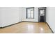 Bright bedroom with neutral walls, hardwood floors, and windows, creating a cozy atmosphere at 553 N Logan St, Denver, CO 80203
