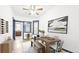 Inviting dining room with stylish furnishings, modern light fixture and adjacent dining area at 553 N Logan St, Denver, CO 80203