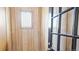 Inviting entryway with wood-paneled walls, decorative window, and stylish glass-paneled door at 553 N Logan St, Denver, CO 80203