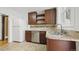 Kitchen includes stainless steel appliances, granite countertops, wooden cabinets, and tile backsplash at 553 N Logan St, Denver, CO 80203