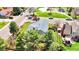Charming home with a gray roof, complemented by mature trees and a well-kept lawn near a neighborhood park at 8133 W Quarto Ave, Littleton, CO 80128